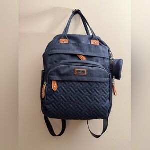 Navy blue diaper bag backpack with brown faux leather accents from Babbleroo EUC